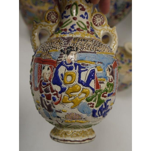 52 - A collection of Japanese pottery vases, early 20th century, each decorated in raised enamels with fi... 