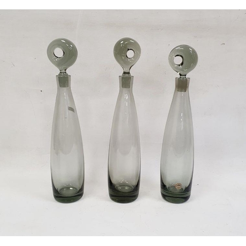 88 - Three Holmegaard smokey glass decanters