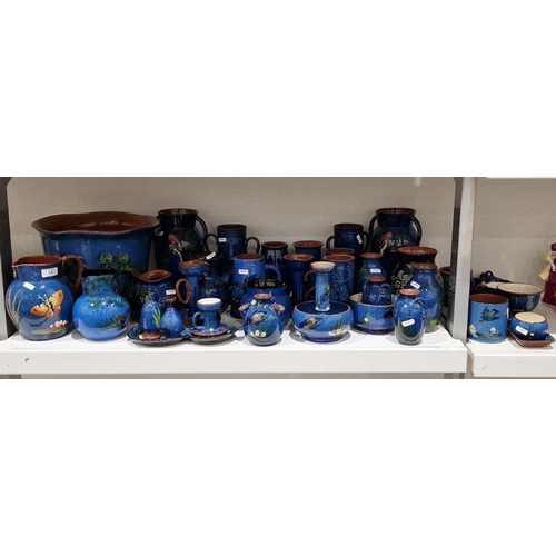 13 - Large quantity of Watcombe Torquay and similar blue and brown pottery decorated with birds, to inclu... 