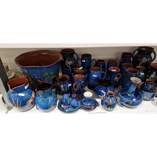 13 - Large quantity of Watcombe Torquay and similar blue and brown pottery decorated with birds, to inclu... 