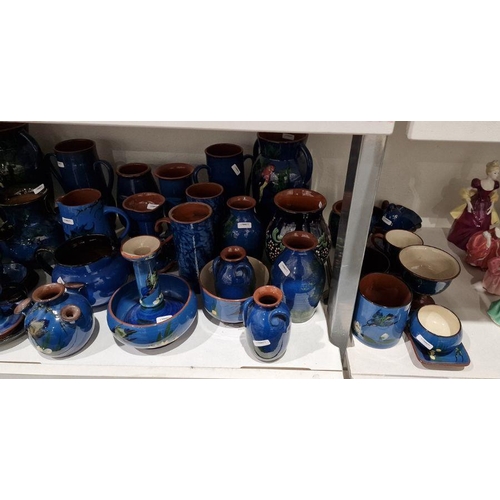 13 - Large quantity of Watcombe Torquay and similar blue and brown pottery decorated with birds, to inclu... 