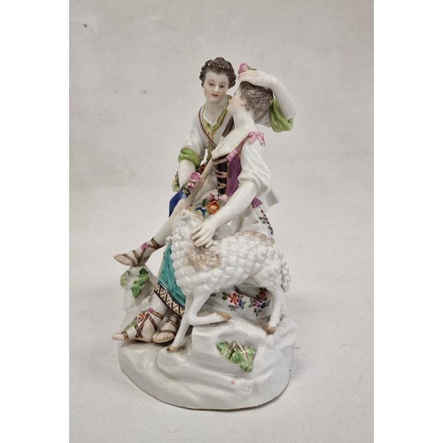 54 - 19th century Meissen porcelain figure group of shepherd and shepherdess seated on rocky mound, the g... 