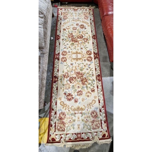 1040 - Large cream ground runner with several floral medallions flanked by floral border 304cm x 99cm and a... 