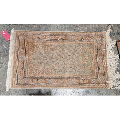 1047 - Three Turkish rugs to include cream ground rug with tree design, floral border, orange ground rug wi... 