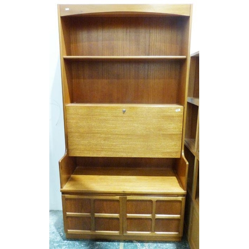 1065 - Mid century modern lounge unit by Nathan with assorted shelves above two cupboard doors, on plinth b... 