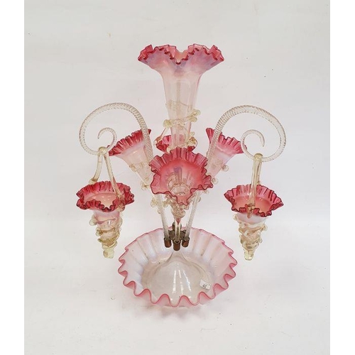 107 - Victorian cranberry and clear frilled epergne with central tapering vase, three further smaller vase... 