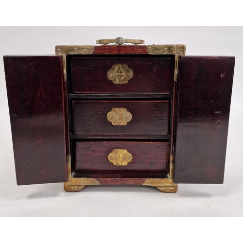 122 - Chinese carved jade, hardwood and brass mounted miniature table cabinet of three drawers and enclose... 