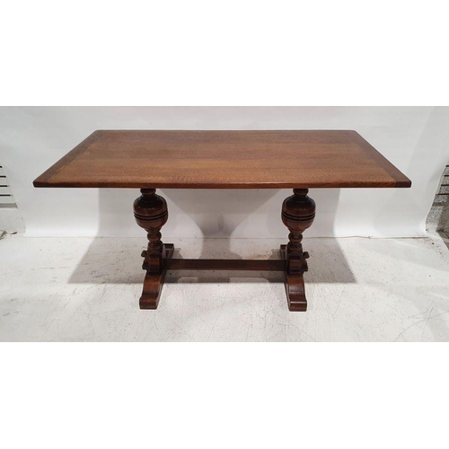 1247 - 20th century oak dining table on cup and cover turned end supports