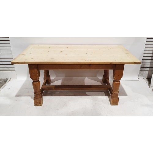 1303 - 20th century pine dining table, the plank top with pleated end supports, on turned and block support... 