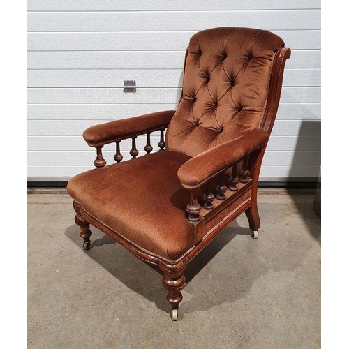 1326 - 19th century armchair with brown upholstered back, seat and armrests, on turned front legs to castor... 