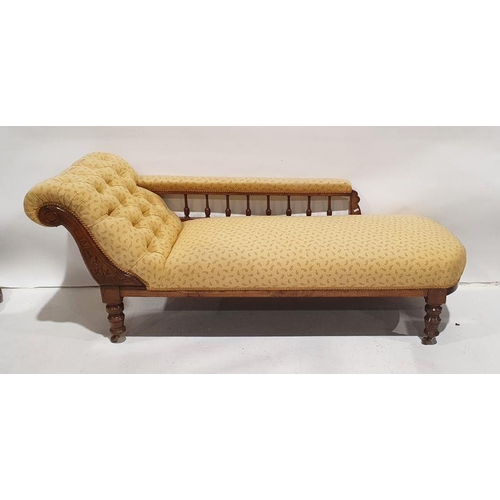 1366 - Victorian chaise longue in yellow upholstery, carved shewwood frame, on turned supports to brown chi... 