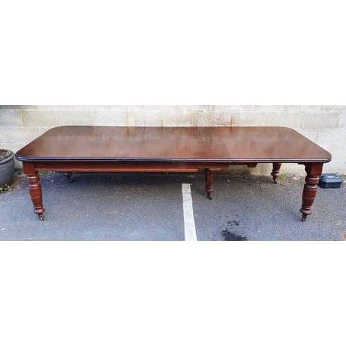 1373 - Victorian mahogany extending dining table, rectangular with curved corners, double mould edge, on he... 