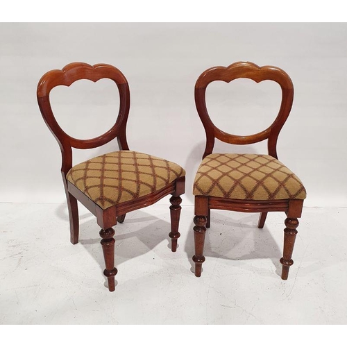 1374 - Eight Victorian walnut dining chairs, each with trefoil hoop back, stuffover seat, on turned support... 