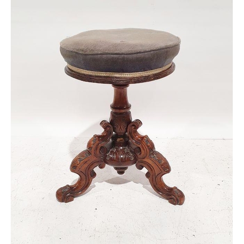 1378 - Victorian mahogany circular piano stool, on turned and carved base and ogee carved legs