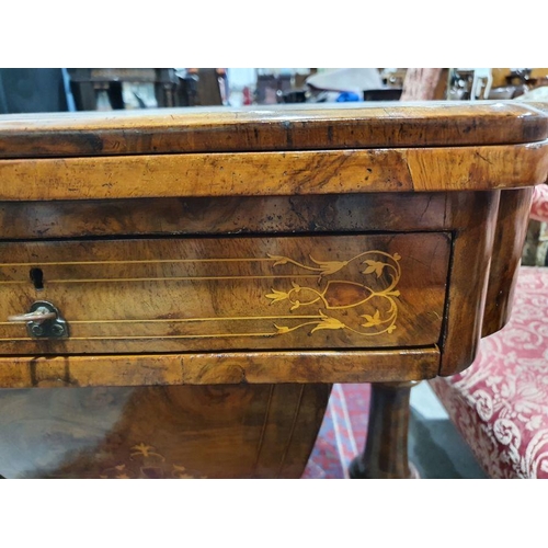 1382 - Early Victorian walnut gaming/work table, the lozenge-shaped top with satinwood inlay, opening to re... 