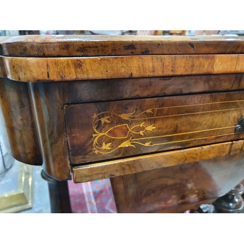 1382 - Early Victorian walnut gaming/work table, the lozenge-shaped top with satinwood inlay, opening to re... 