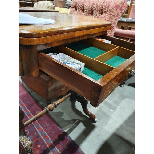 1382 - Early Victorian walnut gaming/work table, the lozenge-shaped top with satinwood inlay, opening to re... 