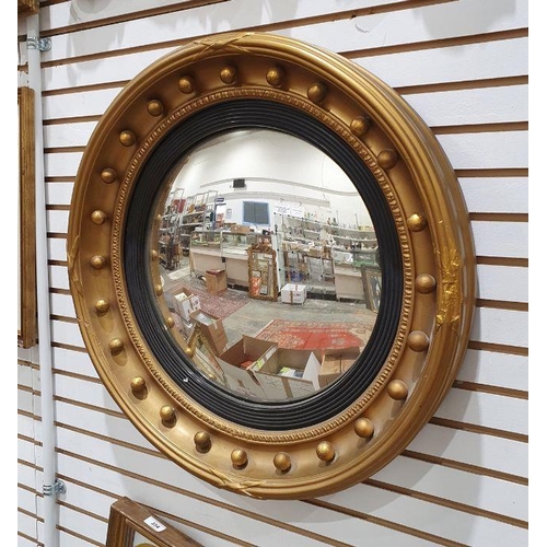 1396 - Victorian-style circular convex mirror with bull decoration to the moulded frame, 60cm diameter