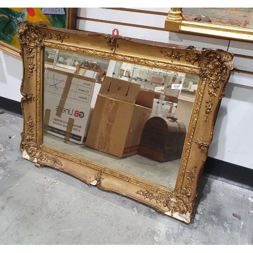 1397 - Rectangular mirror in moulded gilt-effect frame, 64cm x 84cm