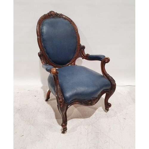 1402 - Victorian armchair in blue upholstered seat, back and armrests, heavily carved frame, serpentine-fro... 