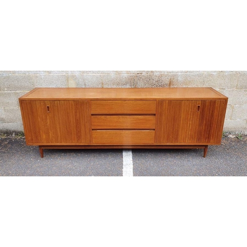 1409 - Mid century modern teak sideboard with three central drawers flanked by folding cupboard doors, on t... 