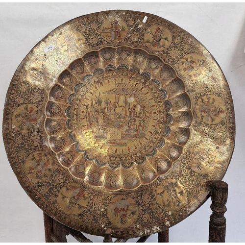 179 - Large Eastern-style brass and engraved tray on folding hardwood base (76 cm diameter)