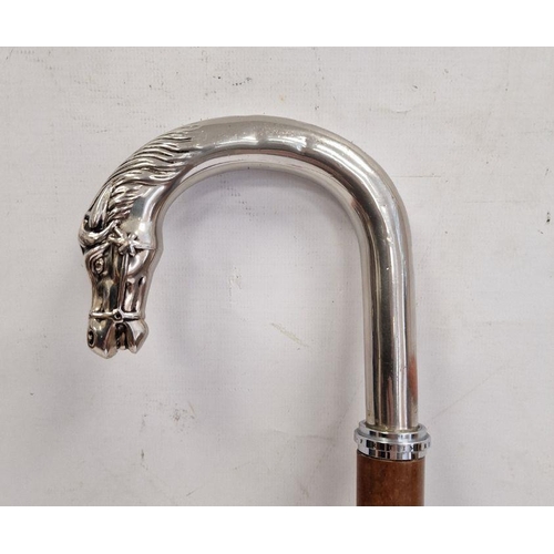 201 - Modern walking stick, the white metal handle terminating in bridled horse's head, together with a co... 