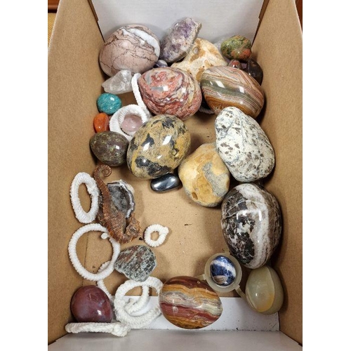 203 - Polished stone eggs, shells, etc (2 trays)