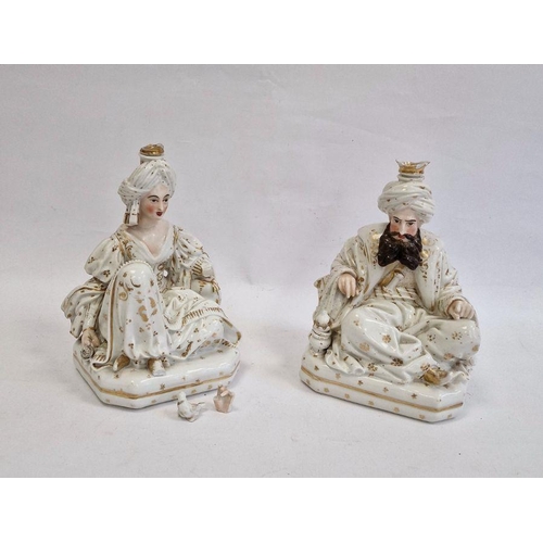 25 - Pair Continental porcelain scent bottle candle holders each of seated figure of an Eastern couple, e... 