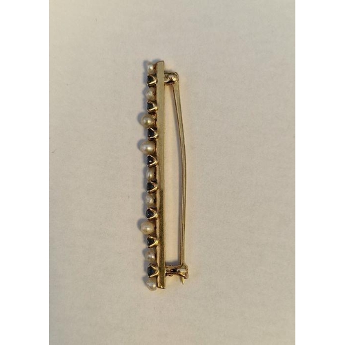 274 - Gold, sapphire and pearl bar brooch set multiple claw set stones and small pearls