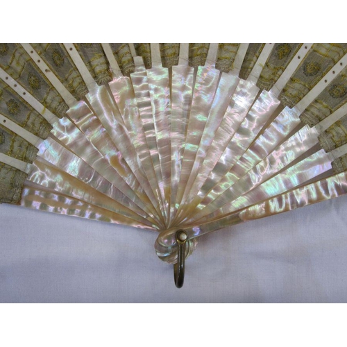 275 - **** WITHDRAWN**** A late 19th Century fan embroidered with silver and gold sequins, mounted on crea... 