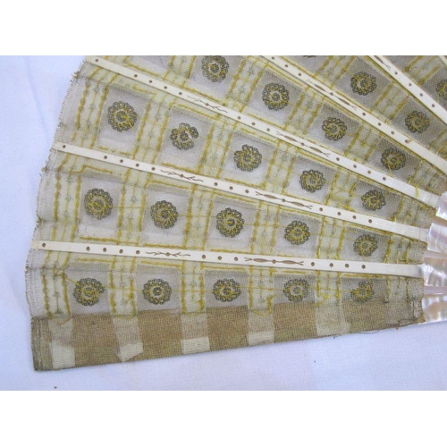 275 - **** WITHDRAWN**** A late 19th Century fan embroidered with silver and gold sequins, mounted on crea... 