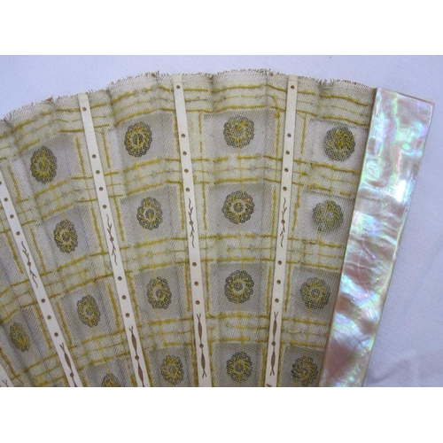 275 - **** WITHDRAWN**** A late 19th Century fan embroidered with silver and gold sequins, mounted on crea... 