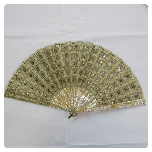 275 - **** WITHDRAWN**** A late 19th Century fan embroidered with silver and gold sequins, mounted on crea... 