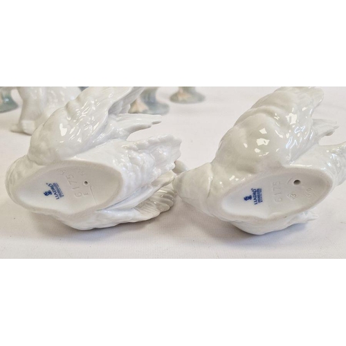 46 - Lladro polar bear family group, two other Lladro model polar bears, two Lladro swans, two Lladro goo... 