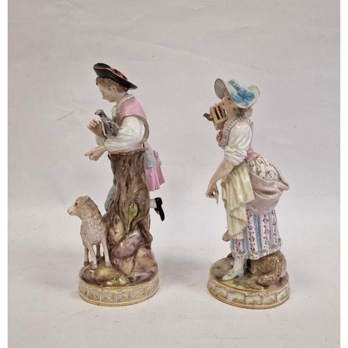 58 - Pair Meissen figures, the lady holding letter, bird in cage on her shoulder and lamb at her feet, we... 