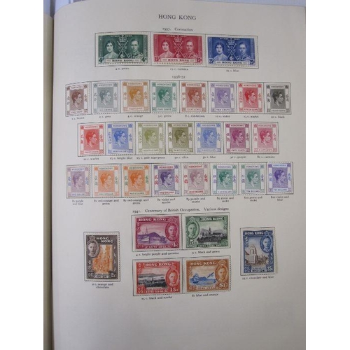 234 - Purposed, 220 page, interleaved red SG 'King George VI' stamp album, 1964 edition, c98% complete.  D... 