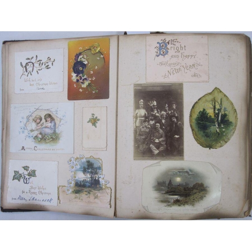 300 - Victorian scrap album containing Victorian scraps, greeting cards to include Christmas and New Year,... 