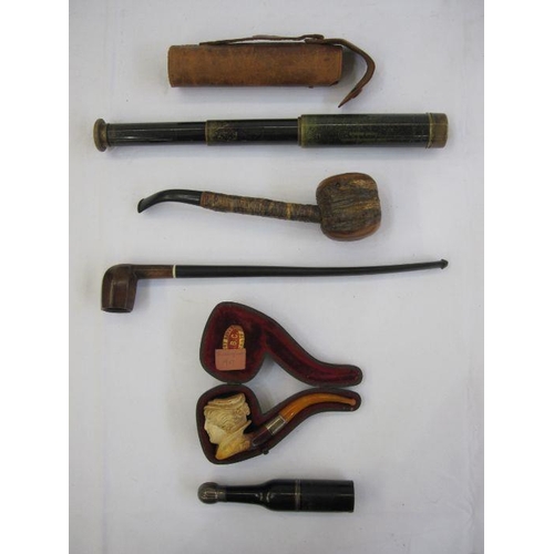 323 - Small brass four-draw telescope with leather case, a Meerschaum silver and amber pipe in the form of... 