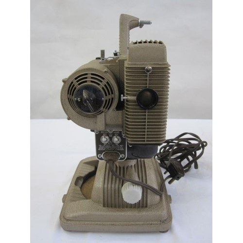 331 - Revere model 85 8mm projector in beige with orange cover, carrying handle and a quantity of 8mm film... 