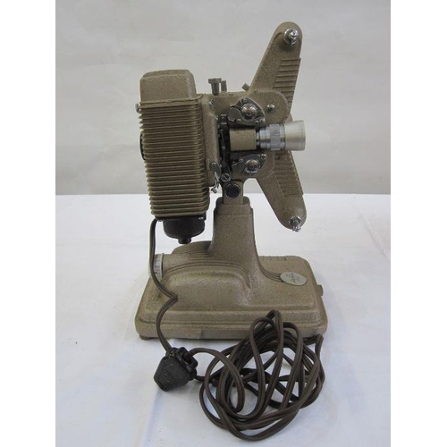 331 - Revere model 85 8mm projector in beige with orange cover, carrying handle and a quantity of 8mm film... 