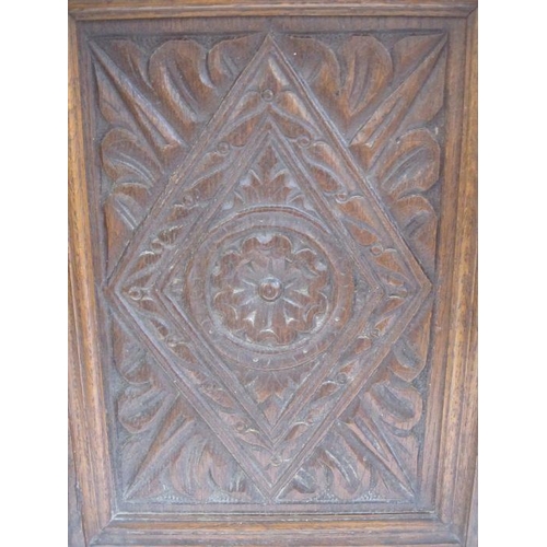 336 - Early 20th century oak smoker's cabinet, the framed panel door carved with foliate and lozenge, flan... 