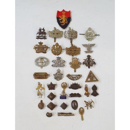 356 - Collection of British and Commonwealth military badges and cap badges.  Army cyclist corps, Gloucest... 