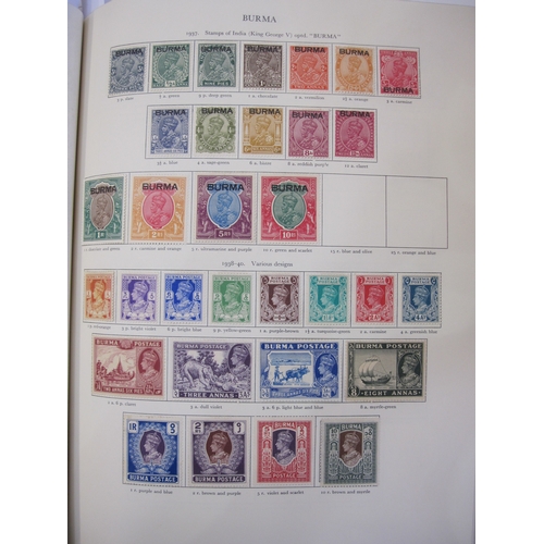 234 - Purposed, 220 page, interleaved red SG 'King George VI' stamp album, 1964 edition, c98% complete.  D... 