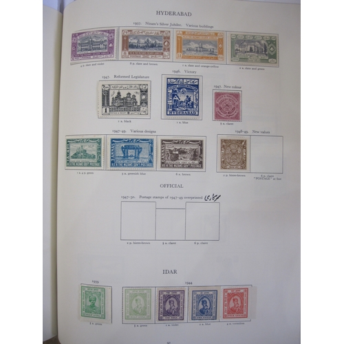 234 - Purposed, 220 page, interleaved red SG 'King George VI' stamp album, 1964 edition, c98% complete.  D... 