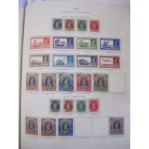 234 - Purposed, 220 page, interleaved red SG 'King George VI' stamp album, 1964 edition, c98% complete.  D... 