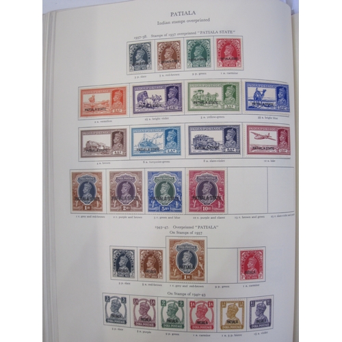 234 - Purposed, 220 page, interleaved red SG 'King George VI' stamp album, 1964 edition, c98% complete.  D... 