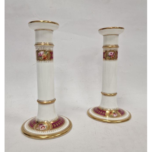 10 - Late 19th century English porcelain pair of candlesticks, each with gilt borders, rose and floral sp... 