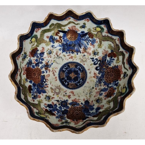 101 - Chinese clobbered pedestal bowl with scalloped border, underglaze blue and enamel decoration of crys... 