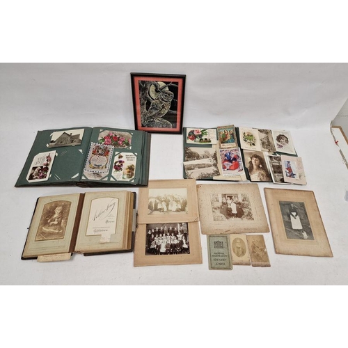 142 - Two vintage postcard albums containing postcards from the 19th and 20th centuries, a Victorian photo... 